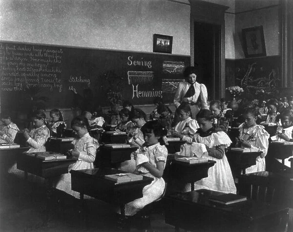 School girls in sewing class, (1899?). Creator: Frances Benjamin Johnston