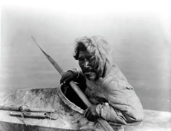 Framed Print : The seal-hunter, Noatak, in kayak, facing left, c1929. Creator: Edward Sheriff Curtis