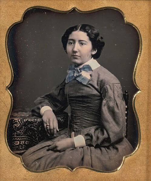 Seated Young Woman Wearing Collar with Large Bow, Resting Arm on Table, 1850s