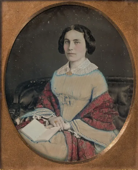 Framed Print : Seated Young Woman Wearing a Shawl, Holding an Open Book in her Lap, 1850s Framed Print : Seated Young Woman Wearing a Shawl, Holding an Open Book in her Lap, 1850s
