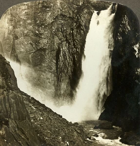 The seething waters of the mighty Voringfos, one of the largest waterfalls of Norway, c1905