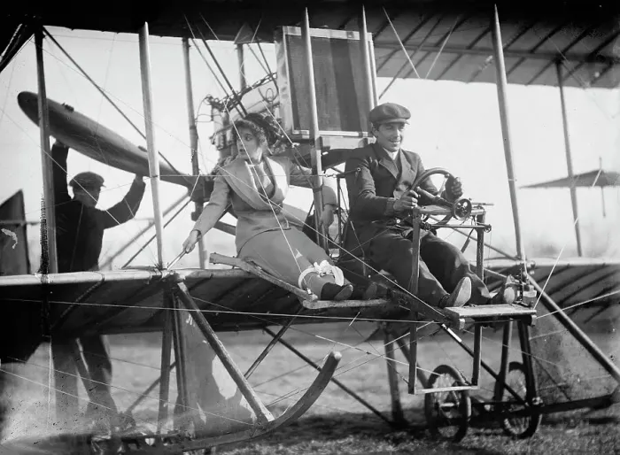 Framed Print : Senorita Lenore Riviero [sic] with Anthony Jannus; In Rex Smith Aeroplane, 1912. Creator: Harris & Ewing. Senorita Lenore Riviero [sic] with Anthony Jannus; In Rex Smith Aeroplane, 1912. Creator: Harris & Ewing