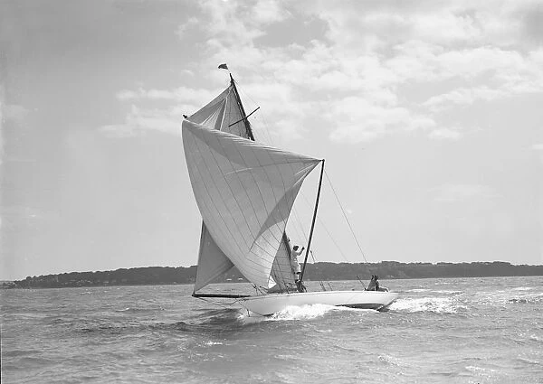 Setting spinnaker on the 8 Metre sailing yacht Spero, 1911. Creator: Kirk & Sons of Cowes