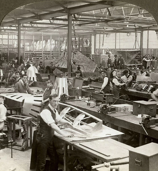 Sheet metal workers at a aeroplane factory, World War I, 1914-1918. Artist: Realistic Travels Publishers