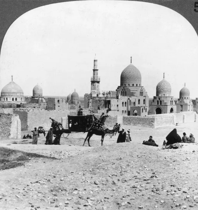 Framed Print : A Ship of the Desert passing tombs of by-gone Moslem rulers, Cairo, Egypt, 1905. Artist: Underwood & Underwood Framed Print : A Ship of the Desert passing tombs of by-gone Moslem rulers, Cairo, Egypt, 1905. Artist: Underwood & Underwood