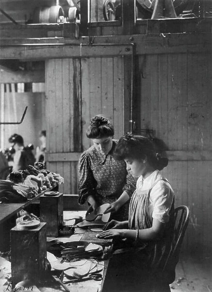 Shoe factories, Lynn, Mass.: 2 women working in shoe factory, (1895?). Creator: Frances Benjamin Johnston
