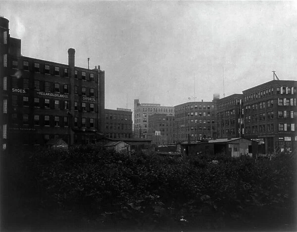 Shoe factories, Lynn, Mass.: exterior view of shoe factories and other buildings, (1895?). Creator: Frances Benjamin Johnston
