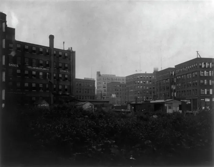 Framed Print : Shoe factories, Lynn, Mass.: exterior view of shoe factories and other buildings, (1895?). Creator: Frances Benjamin Johnston Framed Print : Shoe factories, Lynn, Mass.: exterior view of shoe factories and other buildings, (1895?). Creator: Frances Benjamin Johnston