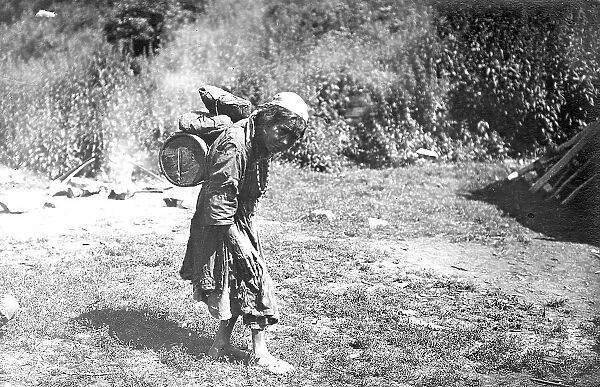 Shoria Woman Carrying a Load, 1913. Creator: GI Ivanov