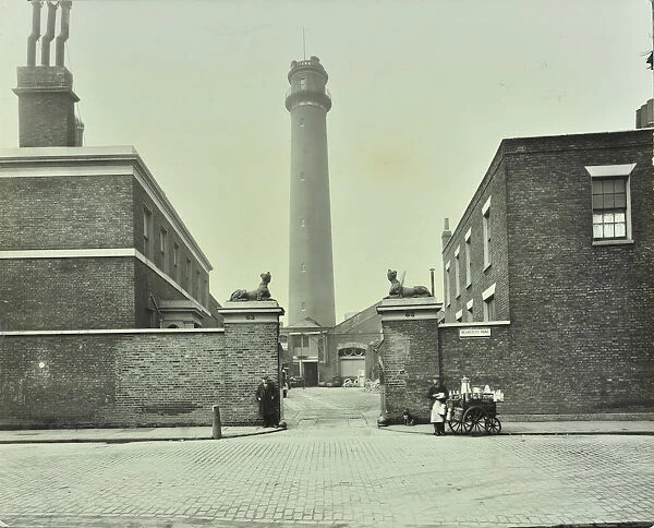 Shot Tower, gates with sphinxes, and milk cart, Belvedere Road, Lambeth, London, 1930
