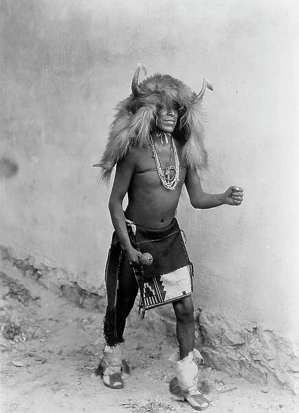 Sia buffalo dancer. Full-length, standing, facing right, c1926. Creator: Edward Sheriff Curtis