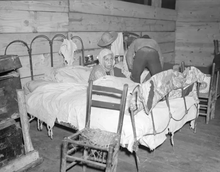 Framed Print : Sick Negro in the Red Cross temporary infirmary for flood refugees, Forrest City, Arkansas, 1937. Creator: Walker Evans Framed Print : Sick Negro in the Red Cross temporary infirmary for flood refugees, Forrest City, Arkansas, 1937. Creator: Walker Evans