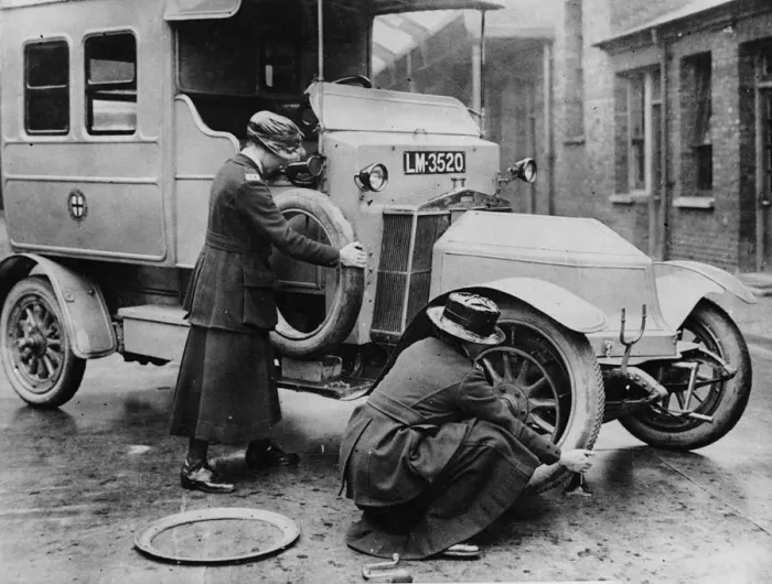 Framed Print : Siddeley Deasy ambulance 1911, women changing wheel. Creator: Unknown Framed Print : Siddeley Deasy ambulance 1911, women changing wheel. Creator: Unknown