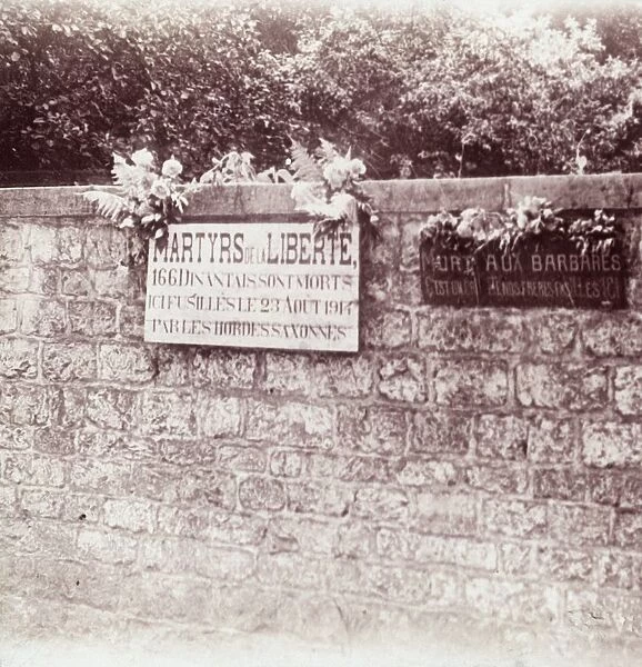 Sign in memory of civilians who were shot by the Germans, Dinant, Belgium, c1914-c1918