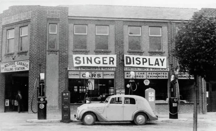 Framed Print : A Singer 11hp Airstream saloon car outside a Welsh garage, Wales, 1935 Framed Print : A Singer 11hp Airstream saloon car outside a Welsh garage, Wales, 1935