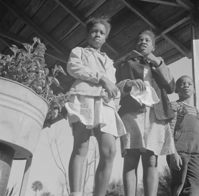 Framed Print : Two sisters with their brother on the front porch of the family home, Daytona Beach, Florida, 1943. Creator: Gordon Parks Framed Print : Two sisters with their brother on the front porch of the family home, Daytona Beach, Florida, 1943. Creator: Gordon Parks