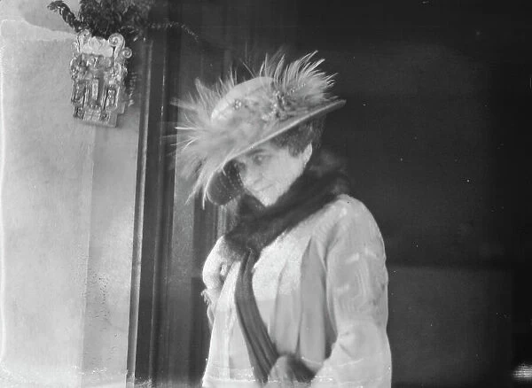 Slater, Mrs. standing by the door of a house in Long Beach, 1924 July. Creator: Arnold Genthe