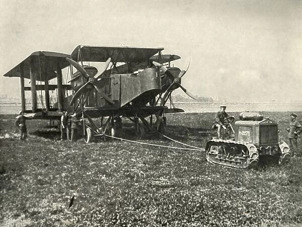 A Small Motor Tractor Getting a Huge R.A.F. Bombing Machine into Position... (1919)