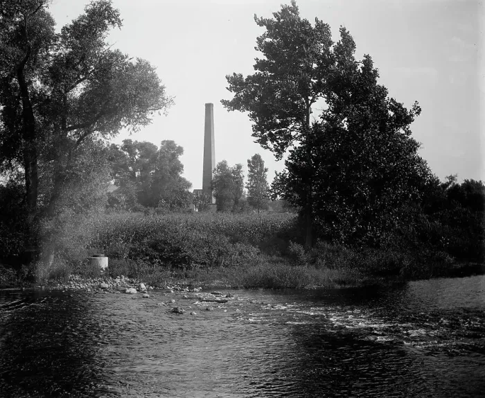Framed Print : Smokestack by river, probably the Huron River, Ypsilanti, Michigan, between 1900 and 1910. Creator: Unknown Framed Print : Smokestack by river, probably the Huron River, Ypsilanti, Michigan, between 1900 and 1910. Creator: Unknown