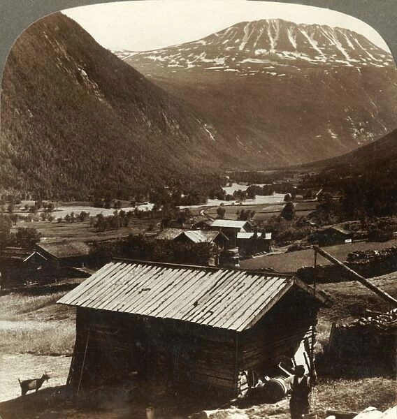 Snowy heights of Mt. Gausta (6180 ft. ), above quiet homes in Maan Valley, Norway, c1905