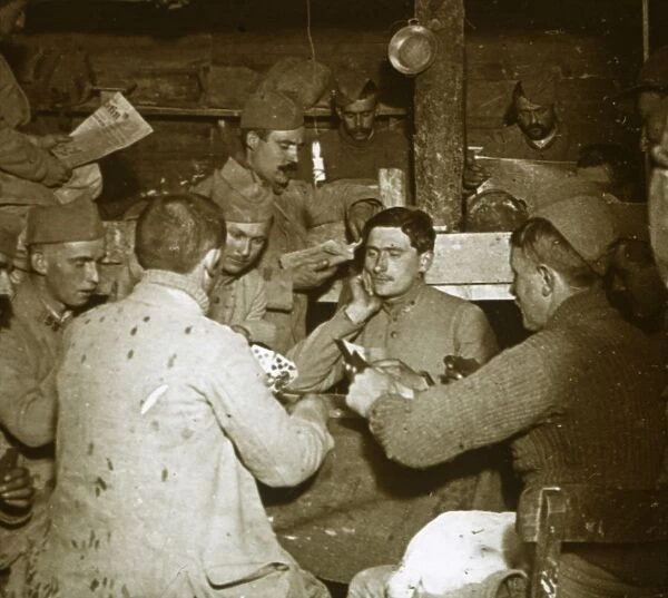 Soldiers playing Manille [card game] in the trenches, c1914-c1918