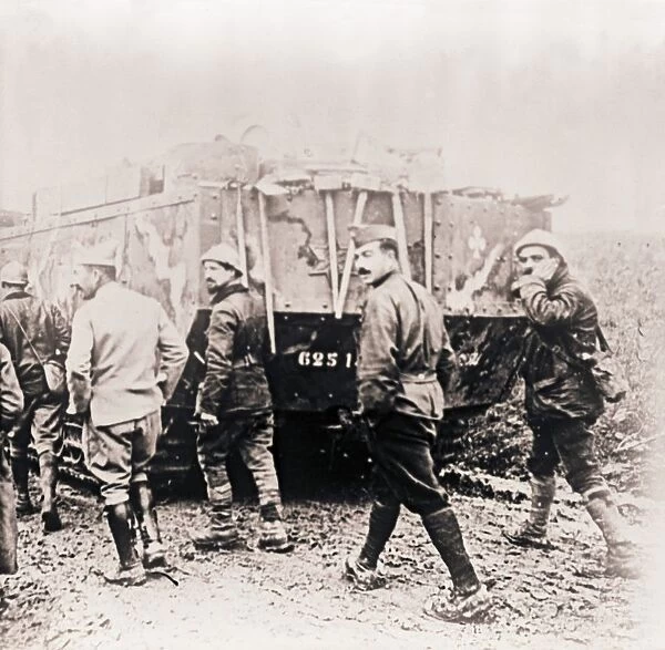 Soldiers walking behind tank, c1914-c1918