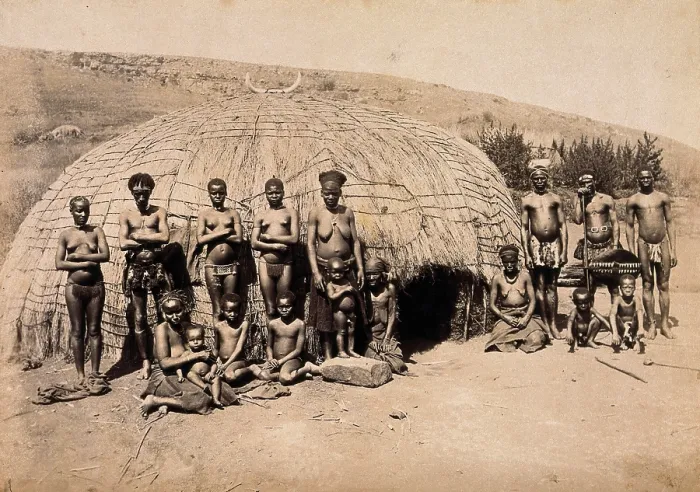 Framed Print : South Africa: Africans in front of a traditional kraal hut, between 1800 and 1899. Creator: Unknown Framed Print : South Africa: Africans in front of a traditional kraal hut, between 1800 and 1899. Creator: Unknown