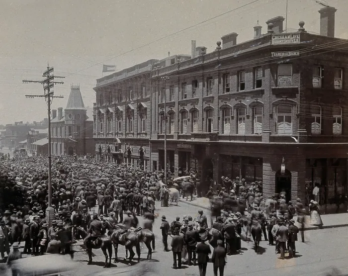 Framed Print : South Africa: a crowd of people gathered outside The Goldfields offices in Johannesburg, 1896. Creator: Unknown Framed Print : South Africa: a crowd of people gathered outside The Goldfields offices in Johannesburg, 1896. Creator: Unknown