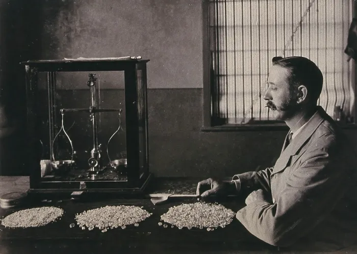 Framed Print : South Africa: an employee of De Beers counting the diamonds mined that day, 1896. Creator: Unknown Framed Print : South Africa: an employee of De Beers counting the diamonds mined that day, 1896. Creator: Unknown