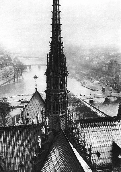 The spire of Notre Dame seen from the towers, Paris, 1931. Artist: Ernest Flammarion