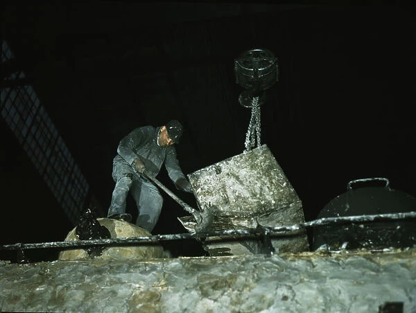 Spreading asbestos mixture on boiler of a locomotive, C & NW RR, 40th Street locomotive shops, 1942. Creator: Jack Delano