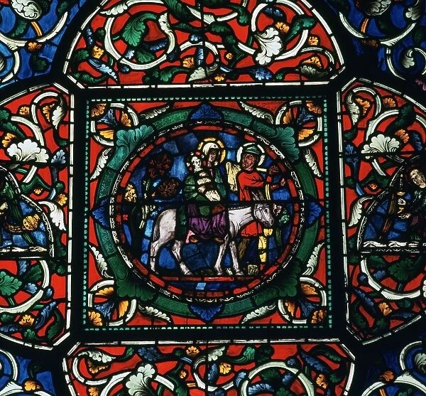 Stained glass depiction of the holy family fleeing to Egypt, 12th century