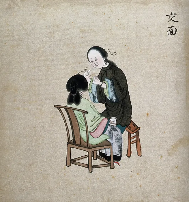 Framed Print : A standing woman preparing to remove facial hair from seated woman using a piece of string, 1800-99. Creator: Unknown Framed Print : A standing woman preparing to remove facial hair from seated woman using a piece of string, 1800-99. Creator: Unknown