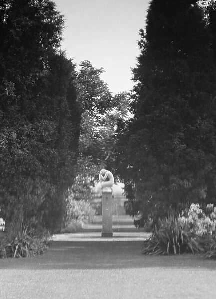 Statue by Paul Manship in the Griffin or Nissen Garden, 1931 June 14. Creator: Arnold Genthe