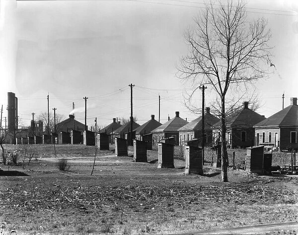 Steelmill workers company houses and outhouses, Republic Steel Company, Birmingham, Alabama, 1936. Creator: Walker Evans