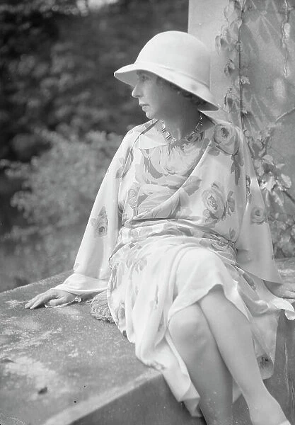 Stettheimer, Florine, Miss, seated outdoors, 1931 Aug. 19. Creator: Arnold Genthe