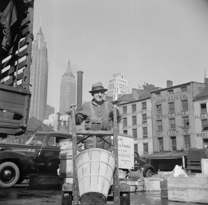 Framed Print : Stevedore who packs and loads crates of fish on the lower east side, 1943. Creator: Gordon Parks