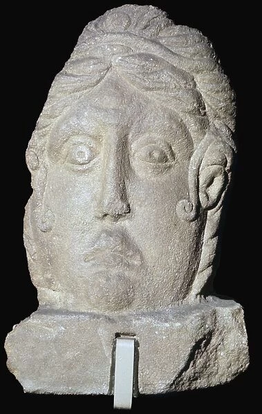 Stone female head, Roman Britain, 1st-4th centuries, from Towcester, Northamptonshire