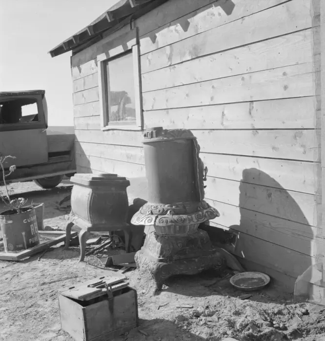 Framed Print : Stoves outside the Browning house being repaired for winter use, Dead Ox Flat, Oregon, 1939. Creator: Dorothea Lange Framed Print : Stoves outside the Browning house being repaired for winter use, Dead Ox Flat, Oregon, 1939. Creator: Dorothea Lange
