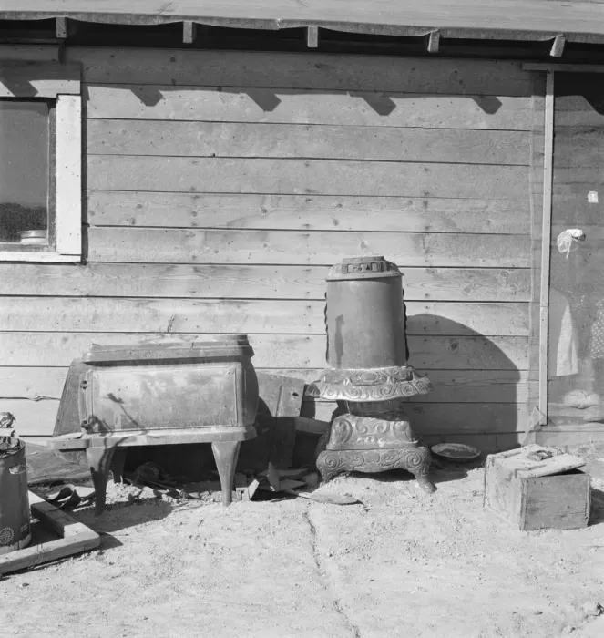Framed Print : Stoves outside the Browning house being repaired for winter use, Dead Ox Flat, Oregon, 1939. Creator: Dorothea Lange Framed Print : Stoves outside the Browning house being repaired for winter use, Dead Ox Flat, Oregon, 1939. Creator: Dorothea Lange