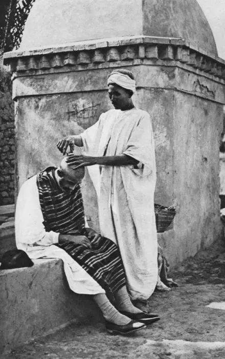 Framed Print : A street barber and his client, Algeria, Africa, 1922. Artist: Donald McLeish Framed Print : A street barber and his client, Algeria, Africa, 1922. Artist: Donald McLeish