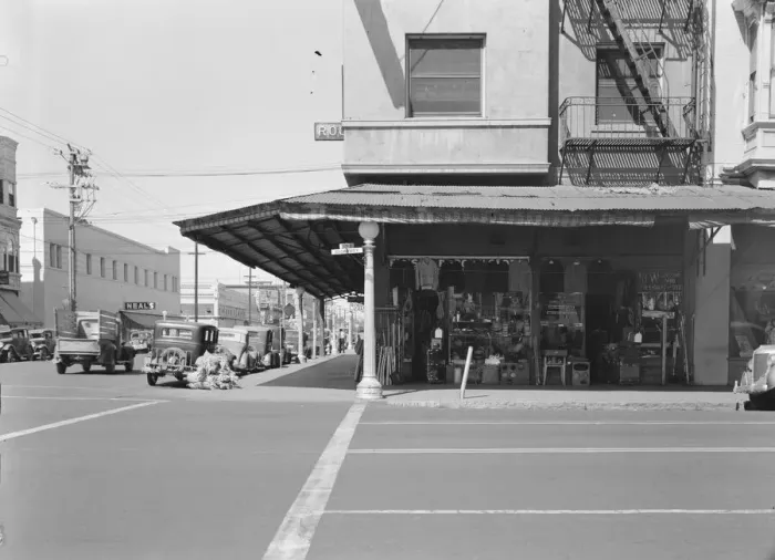 Framed Print : Street corner of San Joaquin Valley town on U. S. 99 showing secondhand store, Fresno, CA, 1939. Creator: Dorothea Lange Framed Print : Street corner of San Joaquin Valley town on U. S. 99 showing secondhand store, Fresno, CA, 1939. Creator: Dorothea Lange