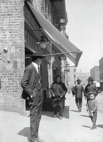 Street scene in Chinatown, San Francisco, between 1896 and 1930. Creator: Arnold Genthe