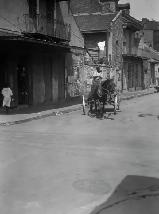 Framed Print : Street scene in the French Quarter, New Orleans, between 1920 and 1926. Creator: Arnold Genthe Framed Print : Street scene in the French Quarter, New Orleans, between 1920 and 1926. Creator: Arnold Genthe