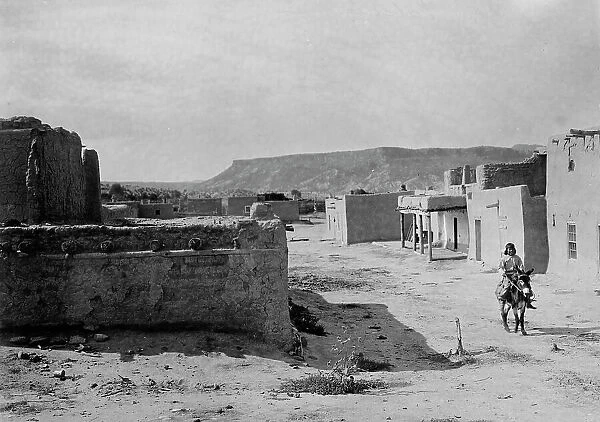 A street scene in San Ildefonso Pueblo, 1905, c1905. Creator: Edward Sheriff Curtis