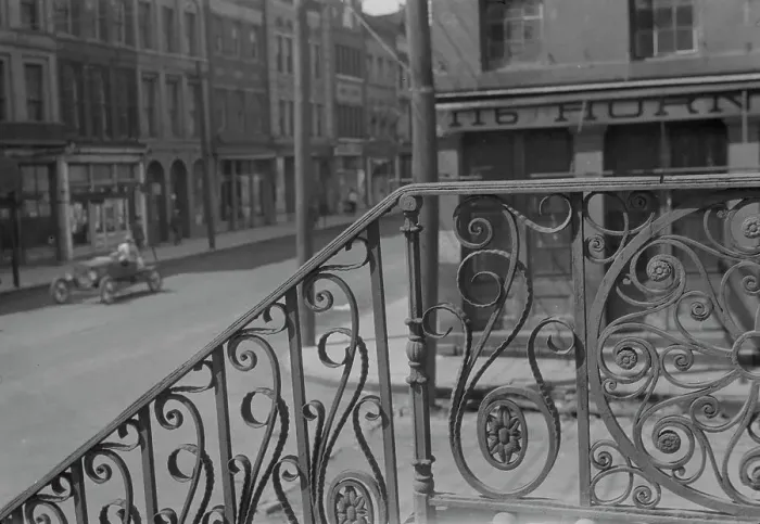 Framed Print : Street seen from behind the wrought iron railing of the Market Hall, Charleston... c1920-c1926. Creator: Arnold Genthe Framed Print : Street seen from behind the wrought iron railing of the Market Hall, Charleston... c1920-c1926. Creator: Arnold Genthe
