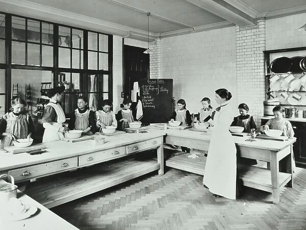 Student teacher in a cookery lesson, Battersea Polytechnic, London, 1907