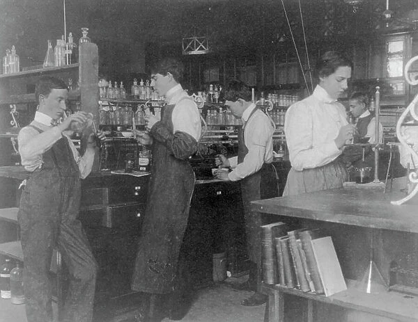 Students in a chemistry class conducting an experiment, Western High School, Washington DC, (1899?). Creator: Frances Benjamin Johnston