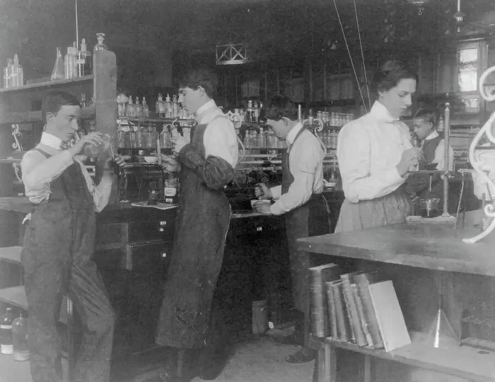 Framed Print : Students in a chemistry class conducting an experiment, Western High School, Washington DC, (1899?). Creator: Frances Benjamin Johnston Framed Print : Students in a chemistry class conducting an experiment, Western High School, Washington DC, (1899?). Creator: Frances Benjamin Johnston
