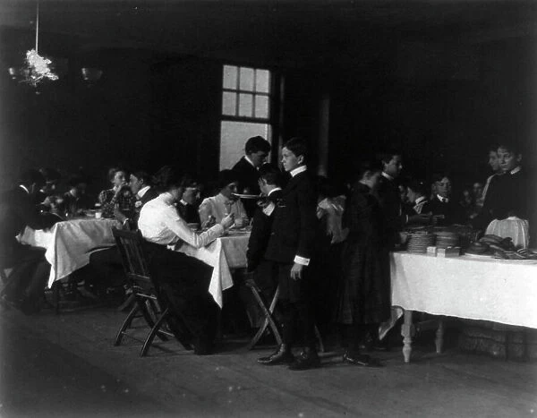 Students having a meal, Western High School, Washington, D.C. (1899?). Creator: Frances Benjamin Johnston